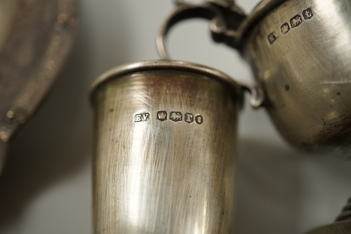An Elizabeth II silver mounted vase with wavy border, Adie Brothers, Birmingham, 1955, weighted, 20.4cm, a silver mounted glass swan bonbon dish, a George V silver three piece condiment set, a silver mounted glass toilet